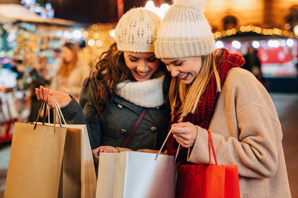 Women shopping wearing coats and beanies