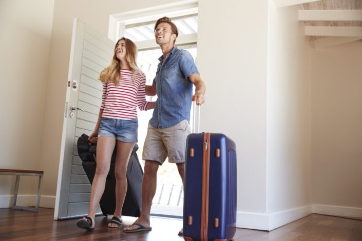 Couple entering their vacation rental