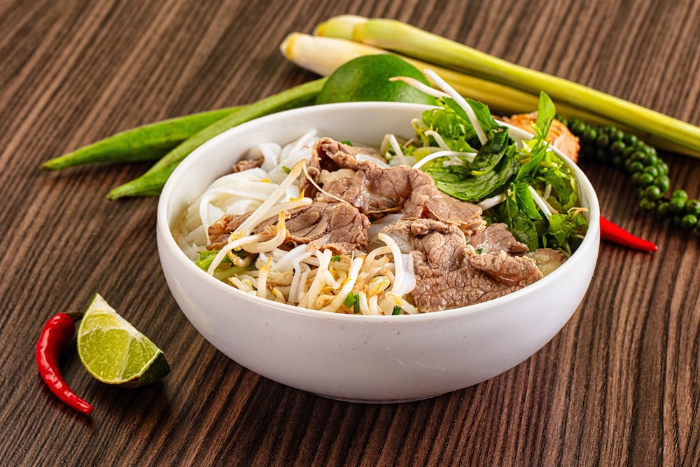 Bowl of Vietnamese pho soup on a table